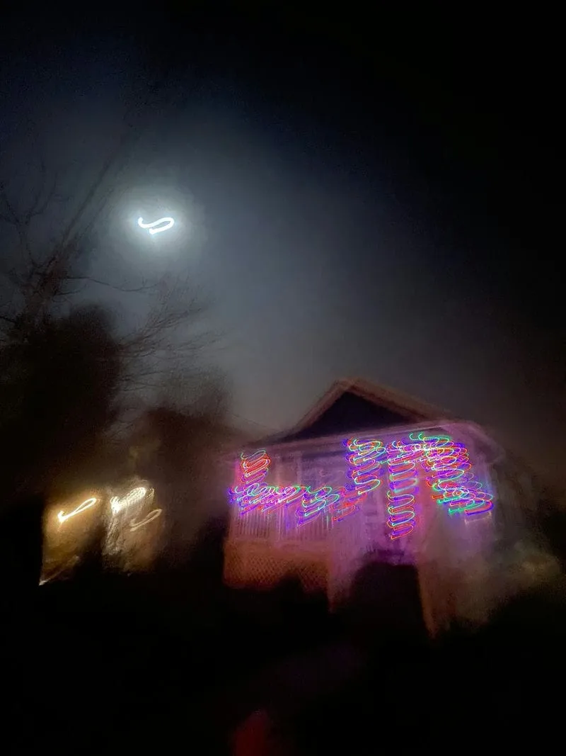 A blurry image of our home at night